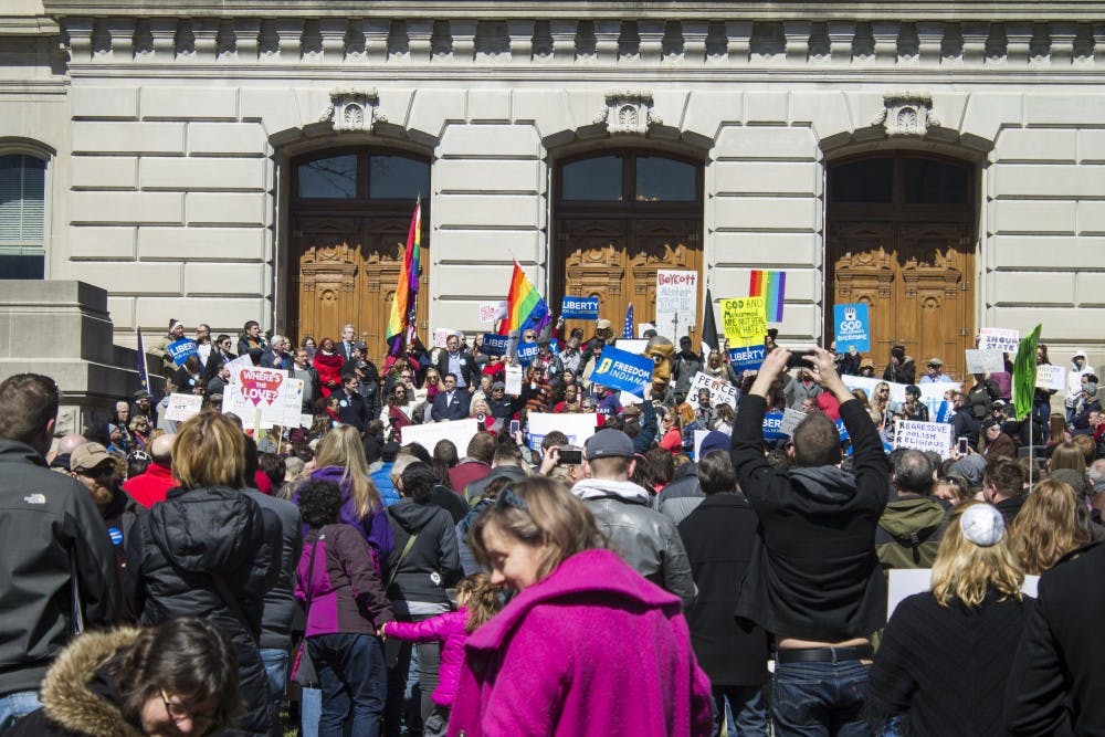 Protesters on the front steps of the Indiana Statehouse. | DN PHOTO BRADLEY DEAN JONES