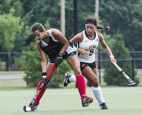 Redshirt sophomore Bianca Velez contends with Iowa's Natalie Cafone during their game on Aug. 22. Ball State's field hockey season starts ib Sep. 1 at James Madison. DN PHOTO JONATHAN MIKSANEK