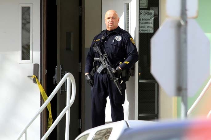 A law enforcement officer stands guard in front of Taft Union High School in Kern County, California, on Thursday, January 10, 2013, after a student opened fire in a classroom. (Irfan Khan/Los Angeles Times/MCT)