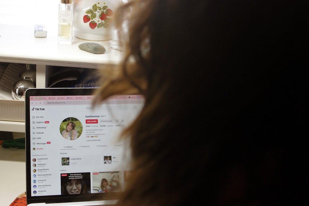 Kat Hawthorne, a second-year acting major at Ball State University, sits in front of her laptop maintaining her TikTok profile Jan. 10 at her apartment on Neely Street, Muncie. Hawthorne, a content creator, said she is disheartened by the platform's ban because "As far as the reception I get on social media, TikTok is by far the nicest." Katherine Hill, DN