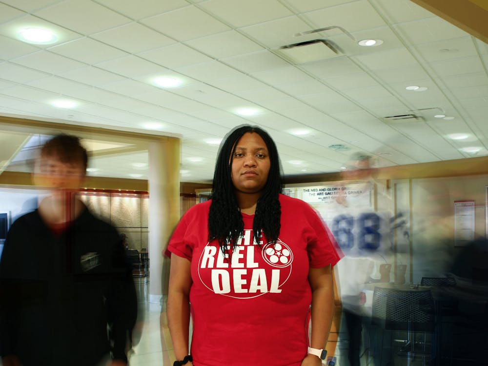 Third-year theatre creation major Keeona Stewart poses for a portrait March 29 in the Atrium. Jacy Bradley, DN Photo; Alex Bracken, DN Photo Illustration