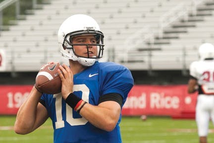Senior quarterback Keith Wenning winds up for a pass during a preseason practice. Wenning is poised to break several team records in the 2013 season. DN PHOTO JORDAN HUFFER