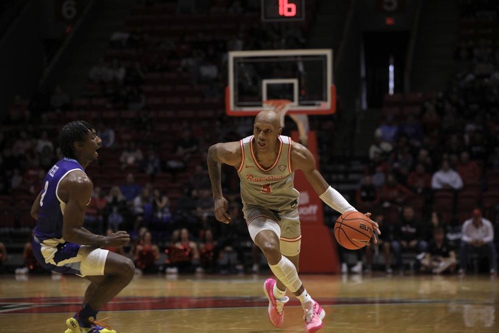 Redshirt senior Mickey Pearson Jr. dribbles the ball in a game against Indiana State Nov. 16. Ball State fell to Indiana State 94-84. Derran Cobb, DN