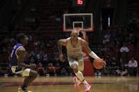 Redshirt senior Mickey Pearson Jr. dribbles the ball in a game against Indiana State Nov. 16. Ball State fell to Indiana State 94-84. Derran Cobb, DN