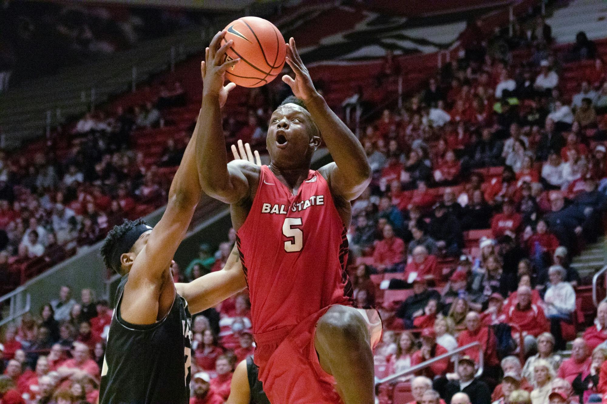 Sophomore center Payton Sparks gets fouled as he goes up for a layup in a game against Eastern Michigan Feb. 3 at Worthen Arena. Sparks had ten rebounds and tallied a double-double in the game. Brayden Goins, DN