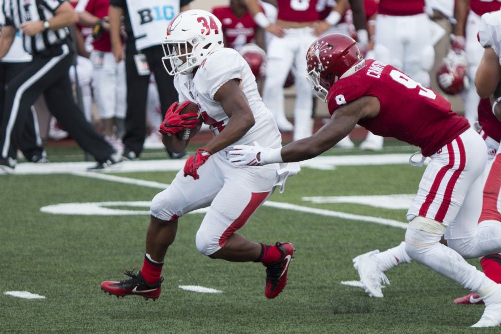 Sophomore running back James Gilbert carries the ball up the middle during Ball State's 30-20 loss to Indiana at Memorial Stadium on Sept. 10. Gilbert leads the Cardinals' rushing attack with 41 carries, 215 yards and two touchdowns through two games. Grace Hollars // DN