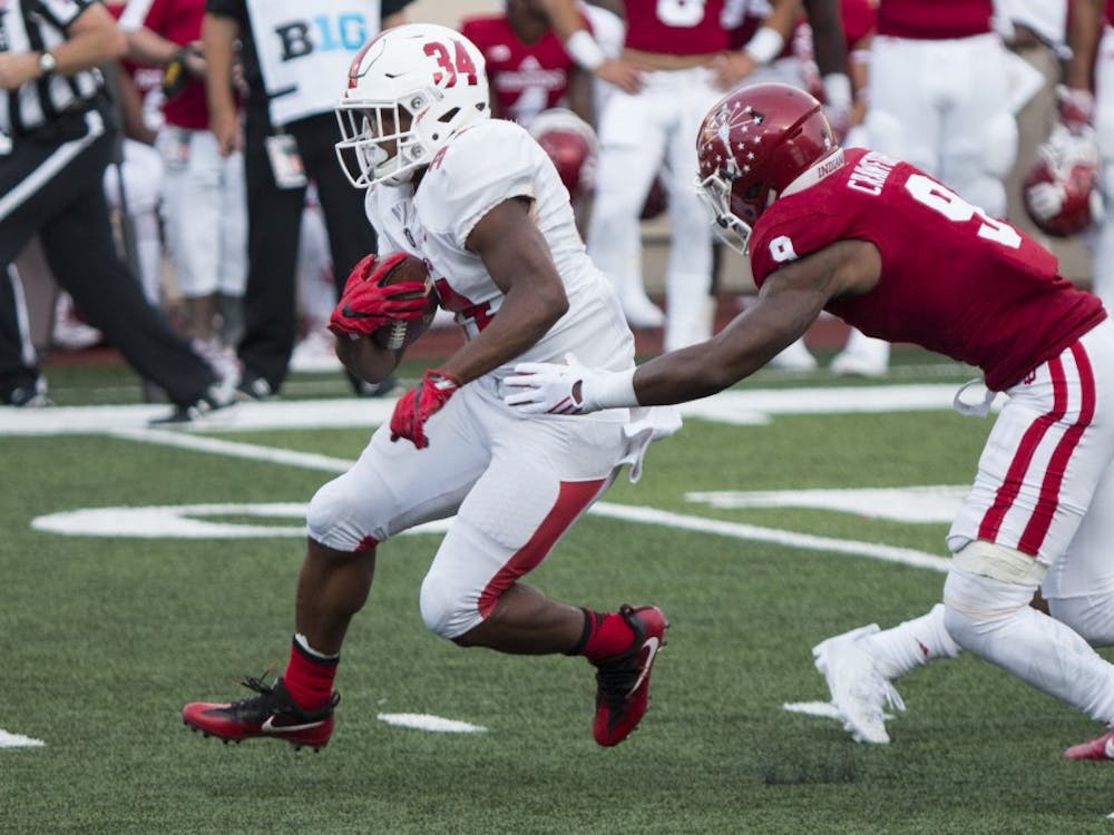 Sophomore running back James Gilbert carries the ball up the middle during Ball State's 30-20 loss to Indiana at Memorial Stadium on Sept. 10. Gilbert leads the Cardinals' rushing attack with 41 carries, 215 yards and two touchdowns through two games. Grace Hollars // DN