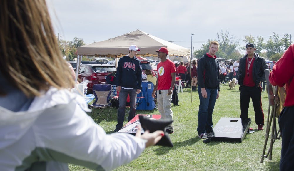 Tailgaters play cornhole before the game against Western Michigan on Oct. 11 at Scheumann Stadium. DN PHOTO BREANNA DAUGHERTY