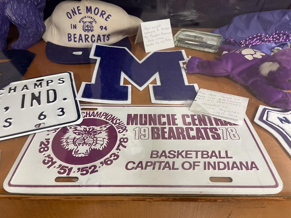 A glass case in the Muncie Fieldhouse memorabilia room showcases an array of artifiacts from the 1960s, '70s and '90s March 25. The center piece claims Muncie, Ind., to be the basketball capital of Indiana. Kyle Smedley, DN