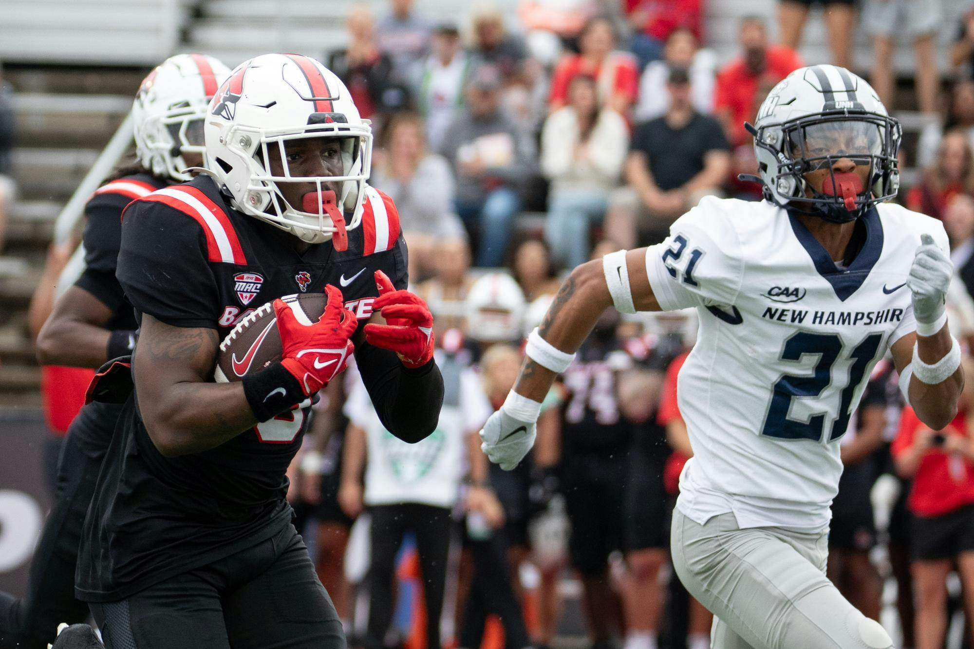 Ball State junior Qua Ashley runs the ball against New Hampshire University Sept. 13 at Scheumann Stadium. Ashley had 154 rushing yards in the game. Andrew Berger, DN 
