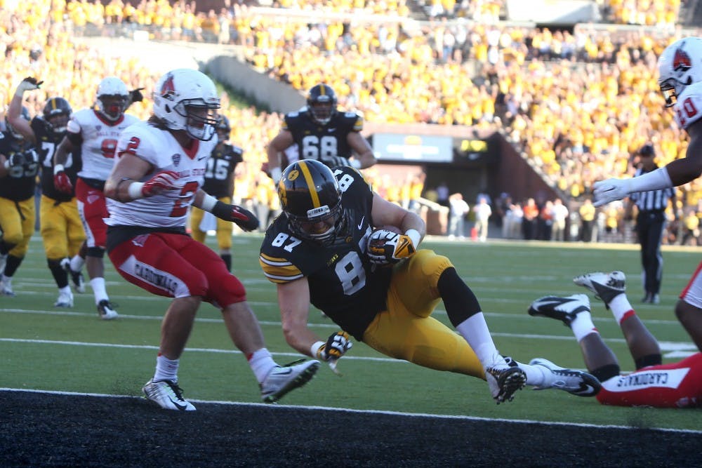 Iowa tight end Jake Duzey scores a touchdown in the last moments of the game in Iowa on Sept. 6. Iowa defeated Ball State, 17-13 because of this play. PHOTO PROVIDED BY TESSA HURSH THE DAILY IOWAN