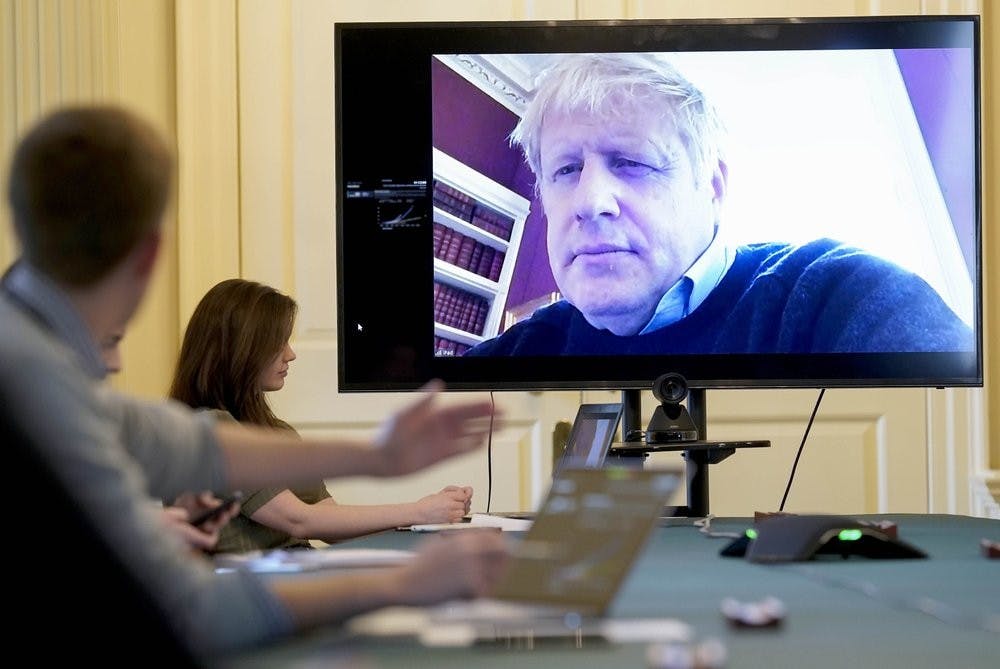 <p>In this Saturday, March 28, 2020 handout photo provided by Number 10 Downing Street, Britain's Prime Minister Boris Johnson chairs the morning Covid-19 Meeting remotely after self isolating after testing positive for the coronavirus, at 10 Downing Street, London. British Prime Minister Boris Johnson has been admitted to a hospital with the coronavirus. Johnson’s office says he is being admitted for tests because he still has symptoms 10 days after testing positive for the virus. <strong>(Andrew Parsons/10 Downing Street via AP, File)</strong></p>
