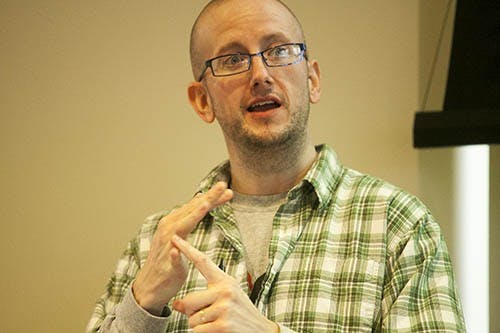 Graduate Student Jason Walls talks about the unhealthy body expectations that are projected by the media. The lecture was hosted in Park Hall and was part of National Eating Disorder Awareness Week. DN PHOTO JORDAN HUFFER