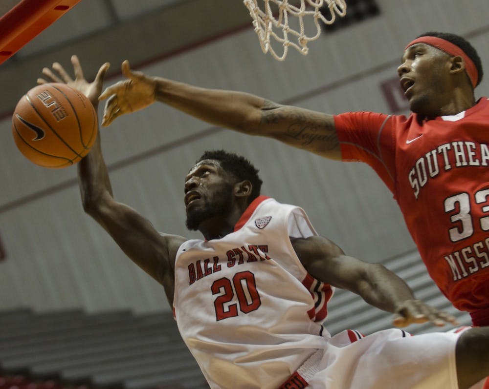 Southeast Missouri sophomore Tyler Stone blocks Chris Bond