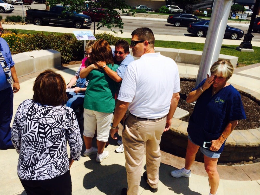 Joyce and Jennifer Smith celebrate after their marriage ceremony outside of the Delaware County Building. The Smiths were one of many same-sex couples who received their marriage licenses June 26. The Delaware County Clerk's Office issued licenses for the first time to same-sex couples that day. DN PHOTO CHRISTOPHER STEPHENS