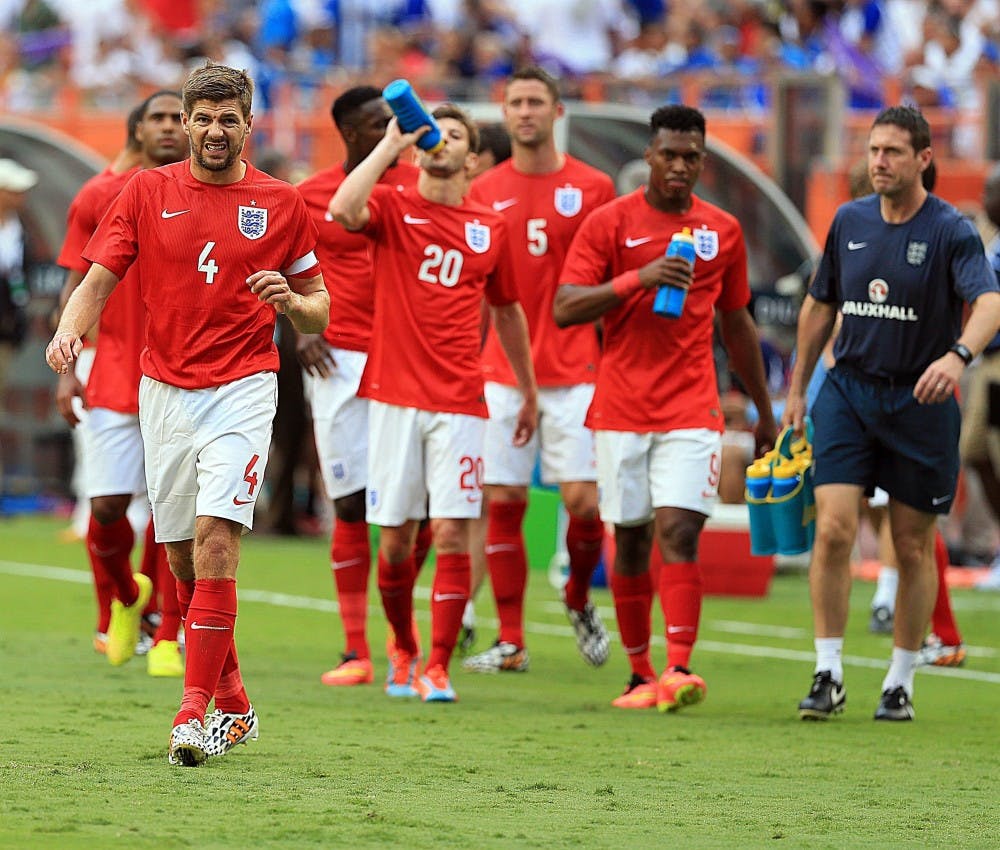 England captain Steven Gerrard (4) leads the team off the field as the match was stopped due to a thunderstorm warning during the first half against Honduras in a friendly in preparation for the World Cup, at Sun Life Stadium in Miami Gardens, Fla., on Saturday, June 7, 2014. The teams tied, 0-0. (Pedro Portal/Miami Herald/MCT)
