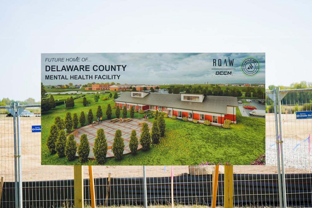 Delaware County Mental Health Facility billboard rendering sits in front of the lot it is being built on Sept. 10. Isabella Kemper, DN