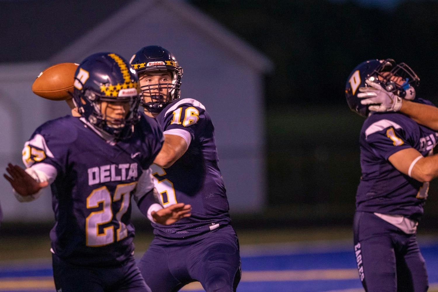 Former Delta sophomore quarterback Palmer Samuels drops back for a pass Sept. 18, 2020, at Delta High School. The Eagles lost to the Marauders 35-0. Jacob Musselman, DN