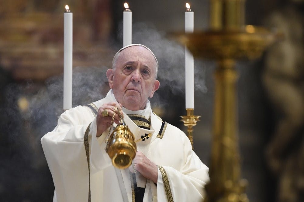 <p>Pope Francis spreads incense at the start of Easter Sunday Mass, inside an empty St. Peter's Basilica at the Vatican, Sunday, April 12, 2020. Pope Francis and Christians around the world marked a solitary Easter Sunday, forced to celebrate the most joyful day in the liturgical calendar amid the sorrowful reminders of the devastation wrought by the coronavirus pandemic. The new coronavirus causes mild or moderate symptoms for most people, but for some, especially older adults and people with existing health problems, it can cause more severe illness or death. <strong>Andreas Solaro/Pool via AP</strong></p>