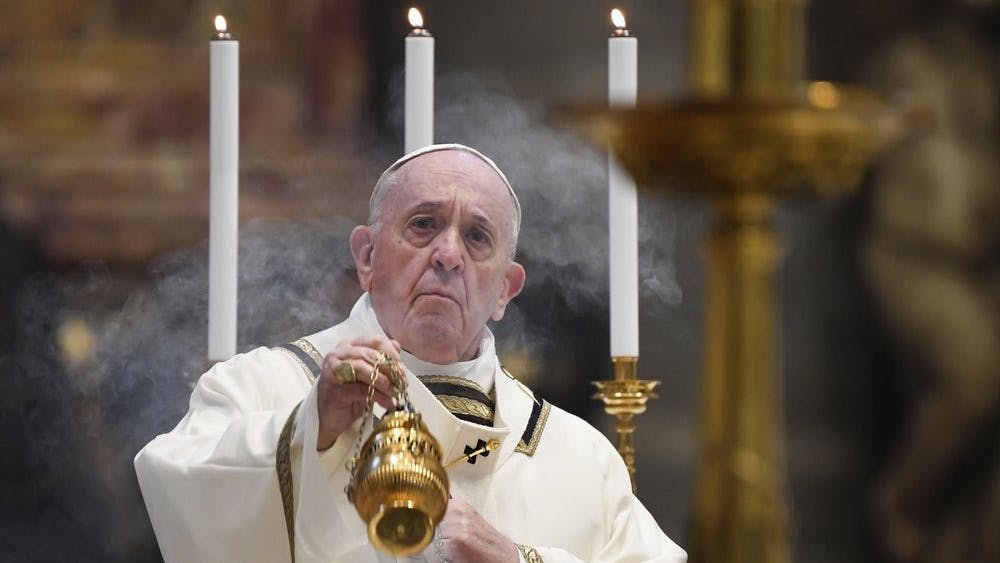 Pope Francis spreads incense at the start of Easter Sunday Mass, inside an empty St. Peter's Basilica at the Vatican, Sunday, April 12, 2020. Pope Francis and Christians around the world marked a solitary Easter Sunday, forced to celebrate the most joyful day in the liturgical calendar amid the sorrowful reminders of the devastation wrought by the coronavirus pandemic. The new coronavirus causes mild or moderate symptoms for most people, but for some, especially older adults and people with existing health problems, it can cause more severe illness or death. Andreas Solaro/Pool via AP