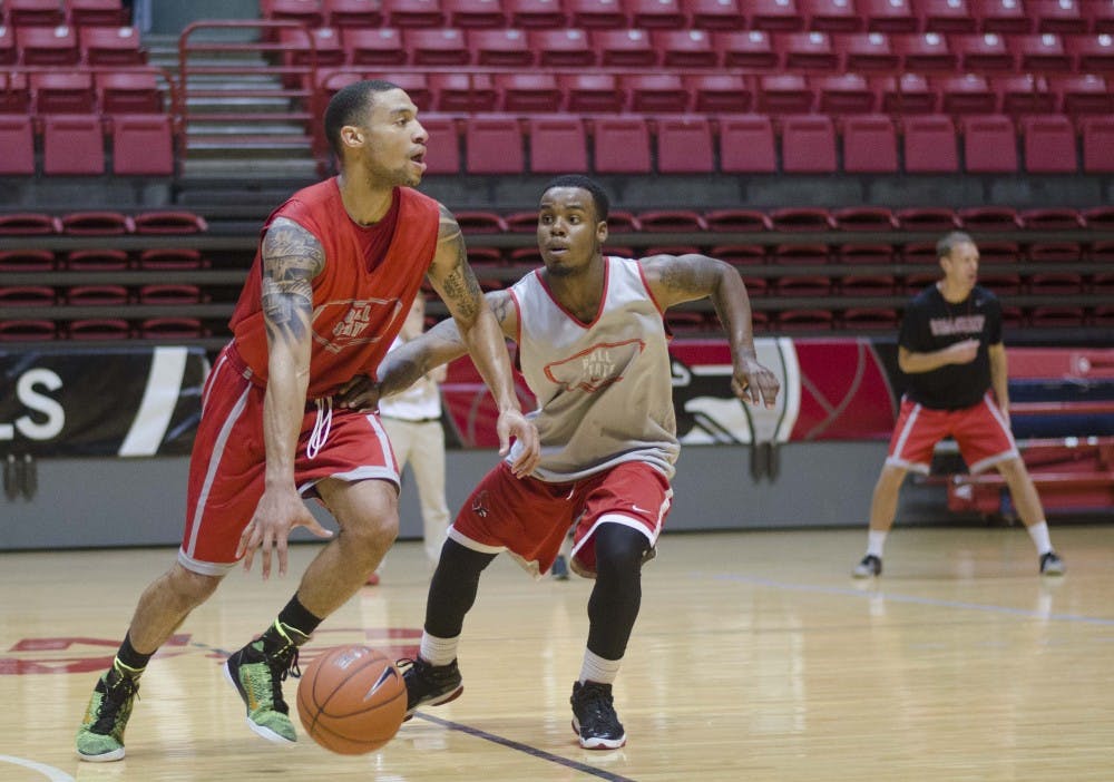 Jeremiah Davis, seen practicing with Zavier Turner, is in his first season at Ball State after transferring from the University of Cincinnati. Davis is a Muncie native and wanted to be near his family after a house fire, prompting his return to Muncie. DN PHOTO BREANNA DAUGHERTY