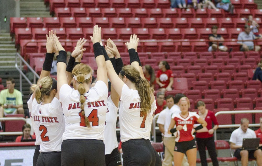Members of the women's volleyball team huddle before the fifth set in the second game of the Active Ankle Tournament against Belmont on Aug. 28 at Worthen Arena. DN PHOTO BREANNA DAUGHERTY