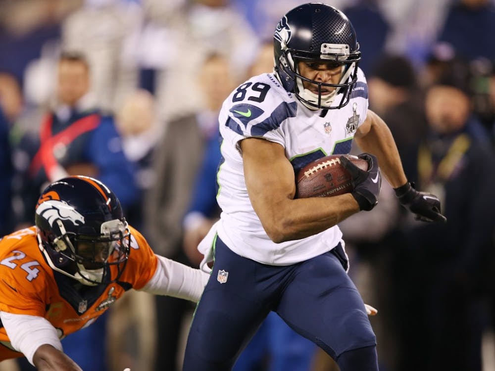 Doug Baldwin (89) of the Seattle Seahawks tries to elude Champ Bailey (24) of the Denver Broncos during the first half of Super Bowl XLVIII at MetLife Stadium in East Rutherford, N.J., on Sunday, Feb. 2, 2014. (J. Patric Schneider/MCT)