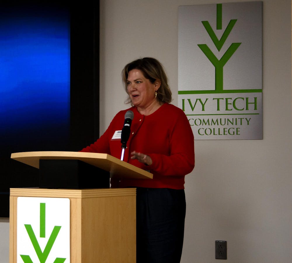 Lochmueller Group Public Outreach Manager Nicole Milton presents the "Improve 32" project to Muncie community members Wednesday, Feb. 5 at the Ivy Tech Fisher Building in Muncie, IN. Lochmueller Group, a consulting group, partnered with the Indiana Department of Transportation to improve four State Road 32 intersections in the city. Hannah Amos, DN