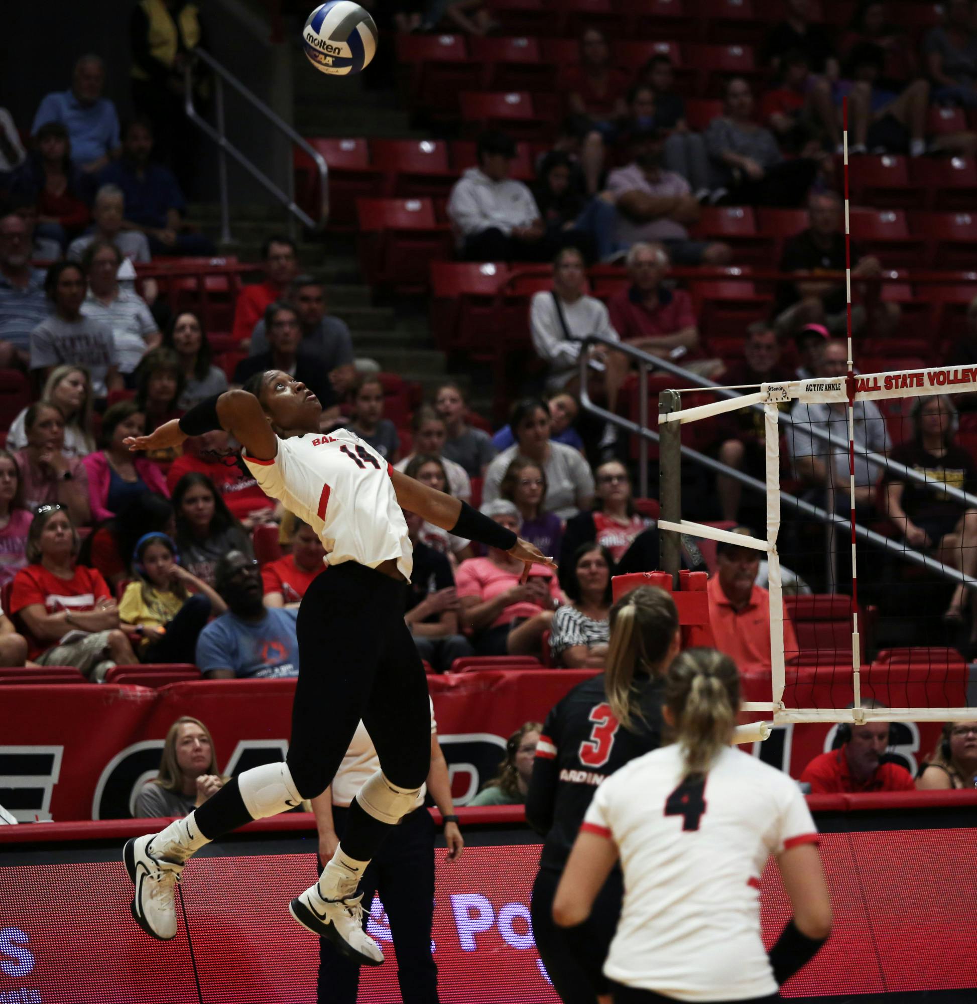 Redshirt freshman middle blocker Aniya Kennedy spikes the ball over the net against Central Michigan Sept. 22 at Worthen Arena. Kennedy scored 13 points in the game. Mya Cataline, DN
