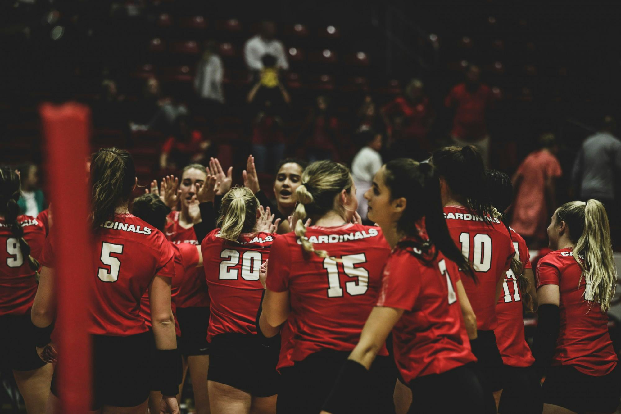 The Ball State women’s volleyball team giving high-fives to each other  to celebrate their win against the Eastern Michigan on Sep. 30 at Worthen arena in Muncie, Indiana. Eve Green, DN