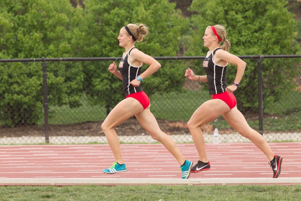 Sisters Caitlynn and Courtney Edon run on the track on April 14, 2012, at Ball State. The twin seniors have been running together all of their lives and look to one another for motivation. PHOTO PROVIDED BY BALL STATE PHOTO SERVICES