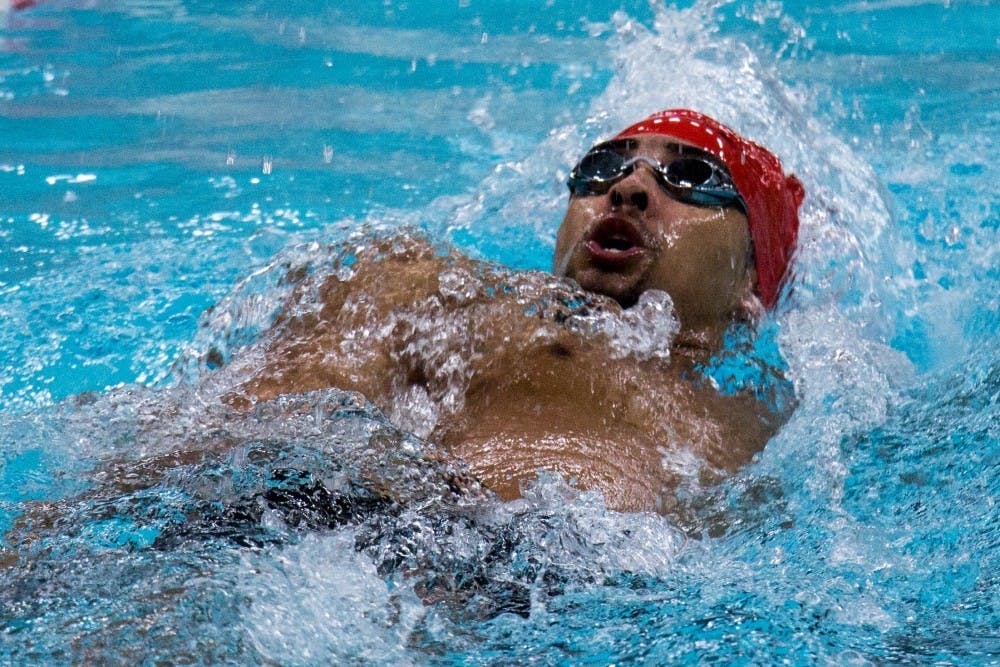 <p>Sophomore Chase Jackson competes the 200-yard backstroke during the meet against Miami Feb. 10 at Lewellen Pool. The team has an all-time record of 341-245-3. <strong>Eric Pritchett, DN</strong></p>