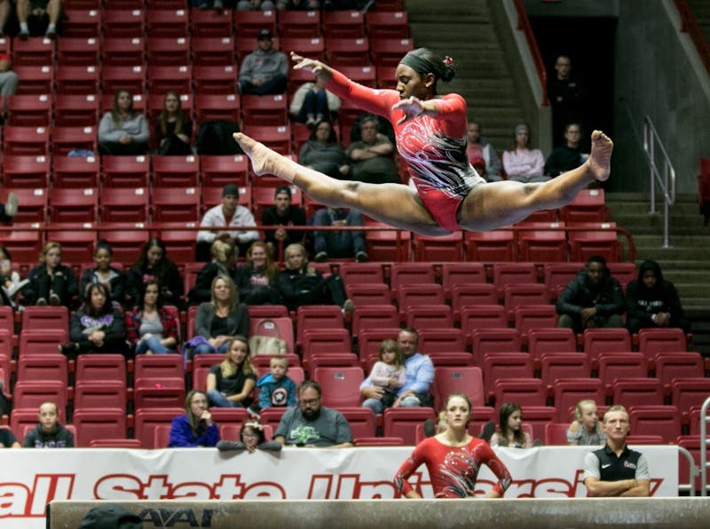 Freshman Tia Kiaku competes on beam during the Red vs. White Intersquad meet Dec. 4 in John E. Worthen Arena. Kiaku is one of six freshmen this year. Kaiti Sullivan, DN File