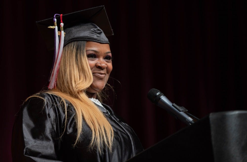 <p>Angela Bennett smiles while giving her speech at the Adult Education Program Class of 2019 Graduation in the Muncie Central &nbsp;High Auditorium May 9, 2019. Bennett battled addiction for 13 years. <strong>Scott Fleener, DN</strong></p>