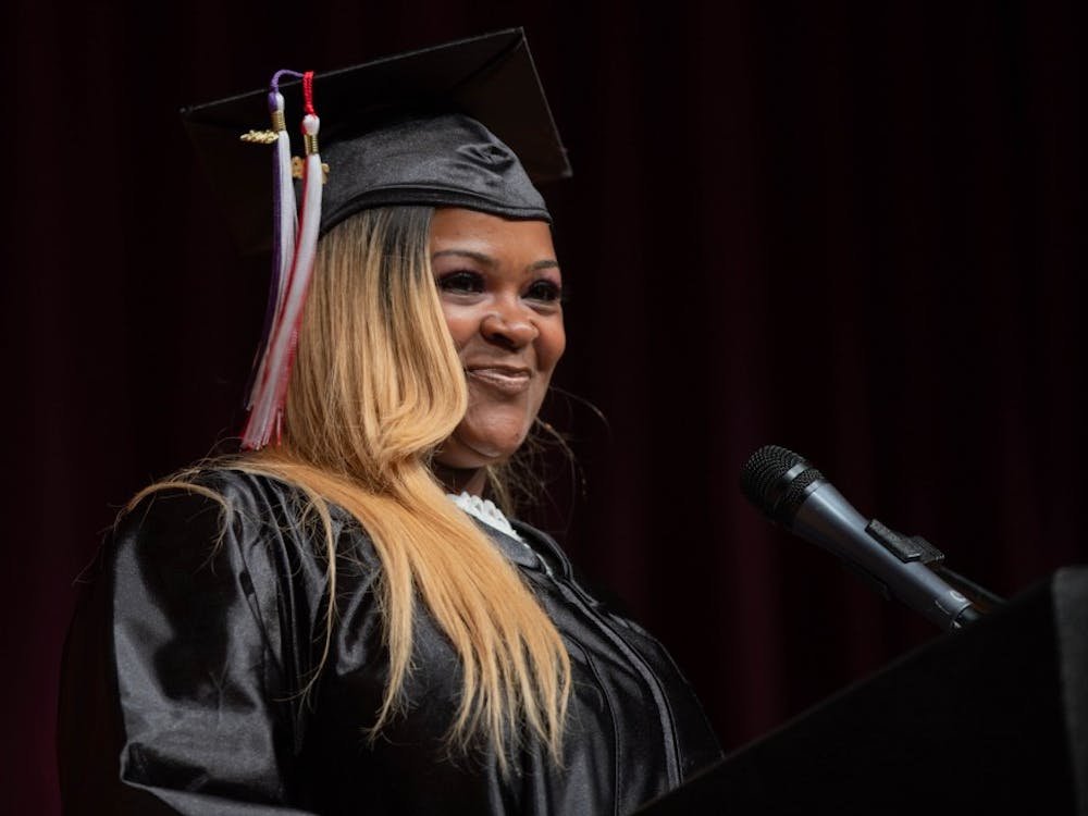 Angela Bennett smiles while giving her speech at the Adult Education Program Class of 2019 Graduation in the Muncie Central High Auditorium May 9, 2019. Bennett battled addiction for 13 years. Scott Fleener, DN