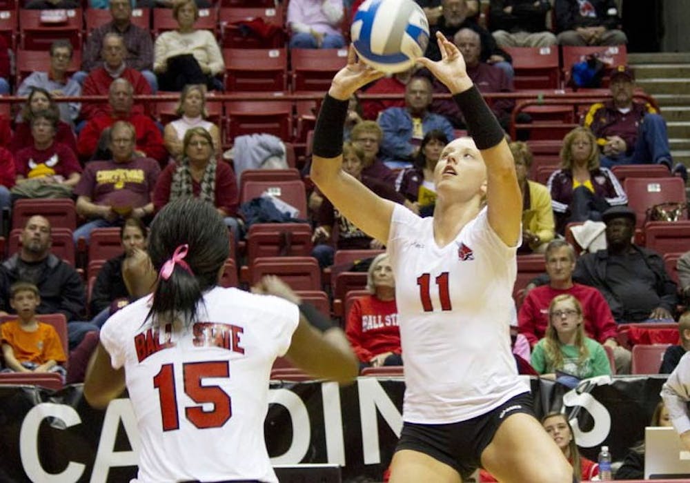 Junior Jacqui Seidel sets the ball for senior Lisa Scott during the game against Central Michigan on Oct. 5. The Cardinals will take on Western Michigan on Friday and Northern Illinois on Sunday. DN FILE PHOTO EMMA FLYNN