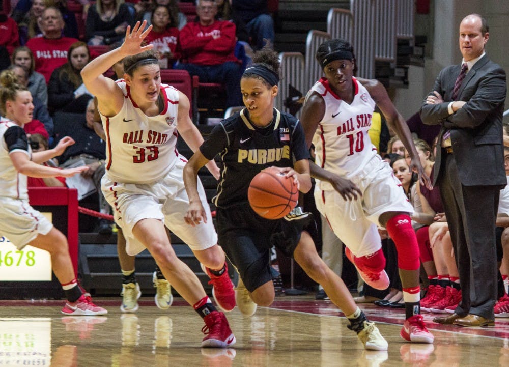 Ball State forward Moriah Monaco and guard Calyn Hosea attempt to block Purdue guard Ashley Morrissette during the game on Dec. 8 in Worthen Arena. The Cardinals lost 58-42. Grace Ramey // DN