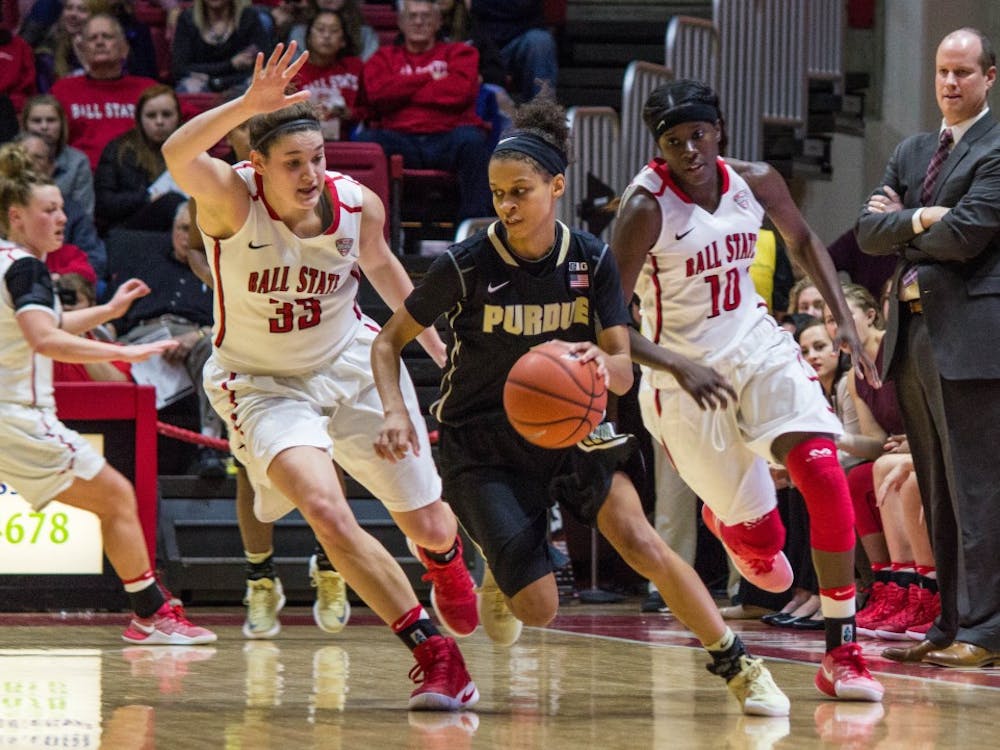 Ball State forward Moriah Monaco and guard Calyn Hosea attempt to block Purdue guard Ashley Morrissette during the game on Dec. 8 in Worthen Arena. The Cardinals lost 58-42. Grace Ramey // DN
