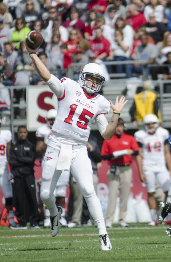 Redshirt sophomore quarterback Ozzie Mann throws the ball in the first quarter in the game against Indiana State on Sept. 13 at Scheumann Stadium. DN PHOTO BREANNA DAUGHERTY 