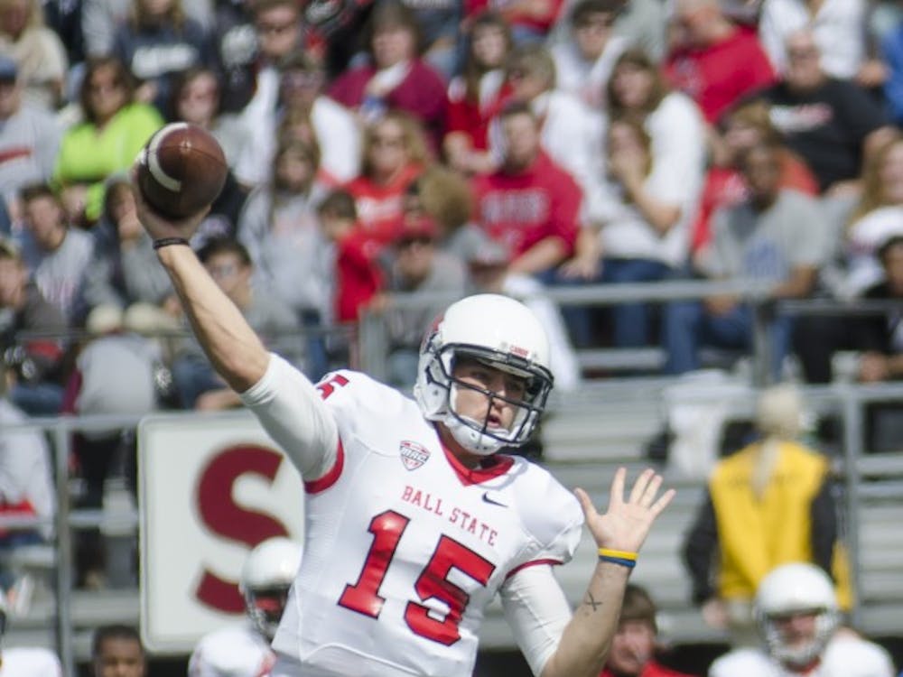 Redshirt sophomore quarterback Ozzie Mann throws the ball in the first quarter in the game against Indiana State on Sept. 13 at Scheumann Stadium. DN PHOTO BREANNA DAUGHERTY 