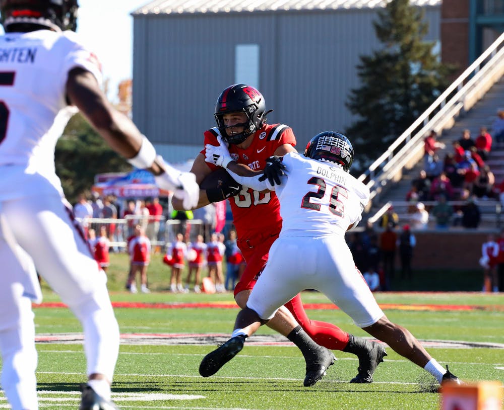 <p>Junior tight end Tanner Koziol runs with the ball Oct. 26 at Scheumann Stadium. Koziol caught 34 passes last season. Isabella Kemper, DN</p>