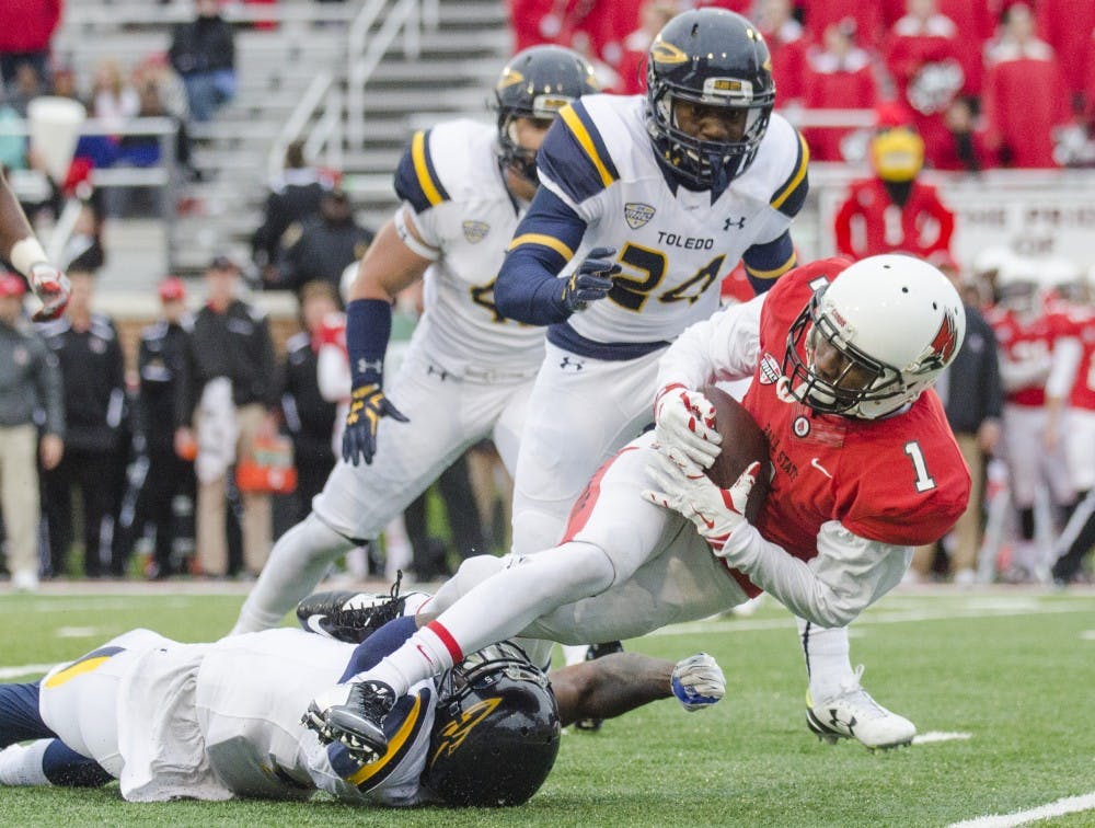 Sophomore wide recover Jordan Hogue gets tackled during the game against Toledo on Oct. 2 at Scheumann Stadium. DN PHOTO BREANNA DAUGHERTY