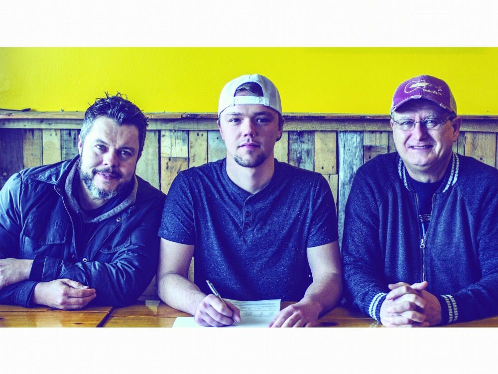 (Left to Right) Jason Wyatt, CEO of Nashville Artist Development, Paul Rosewood and Keith Mohr, NAD team members pose for a picture as Rosewood signs at NAD in March. Rosewood has been a lover of music since he was a child. Paul Rosewood, Photo Provided 