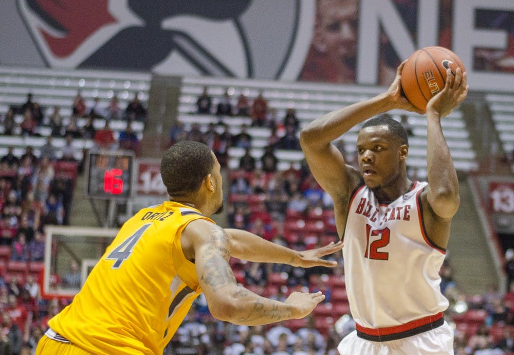 Senior forward Bo Calhoun keeps the ball away from a Kent State player during the game against Kent State on Jan. 19 at Worthen Arena. DN PHOTO BREANNA DAUGHERTY