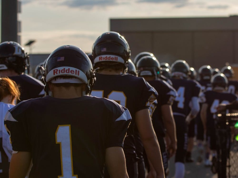 The Delta Eagles walk toward their locker room before the start of their game with the Muncie Central Bearcats Aug. 23, 2019. The Eagles won the game, 42-0. Jacob Musselman, DN
