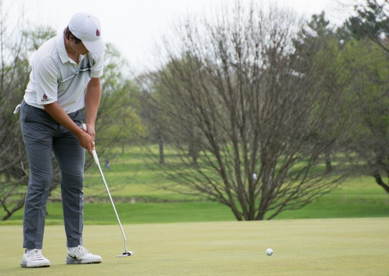Junior Johnny Watts putts the ball during the Earl Yestingsmeier Memorial Invitational on April 14 at the Deleware Country Club.  Ball State scored 720, just behind Eastern Kentucky (714). Kaiti Sullivan // DN