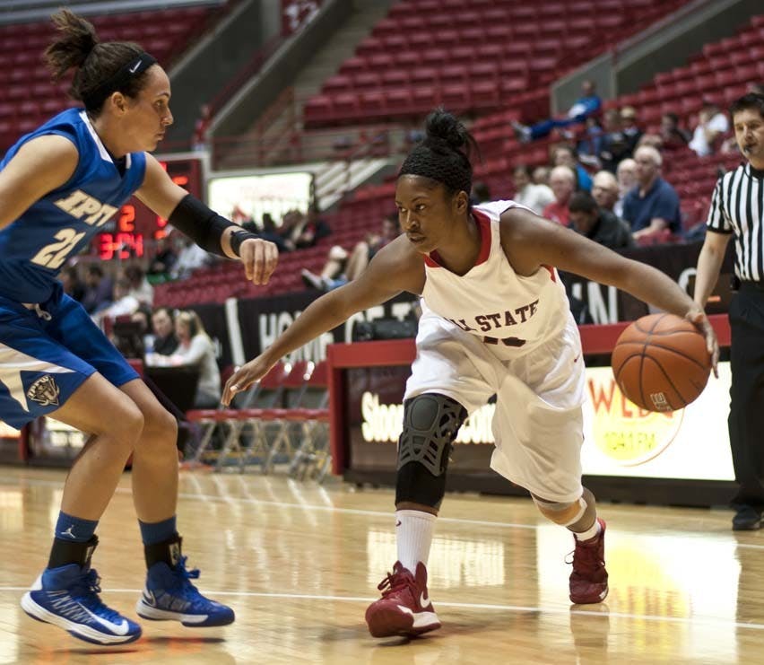 Senior guard Shanee' Jackson, right, drives past guard Mur Hagerman during the IPFW game. Ball State defeated the Mastadons 53-46. DN PHOTO JONATHAN MIKSANEK