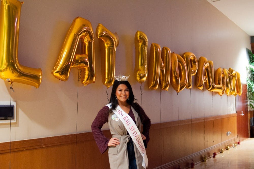 <p>Miss Ball State, Victoria Ruble, poses by the Latinapalooza balloons on Jan. 19. <strong>Madeline Grosh, DN</strong></p>
