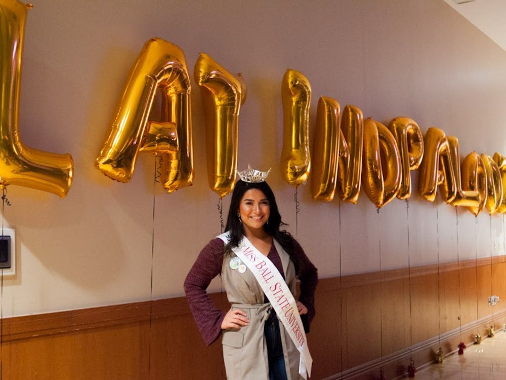 Miss Ball State, Victoria Ruble, poses by the Latinapalooza balloons on Jan. 19. Madeline Grosh, DN