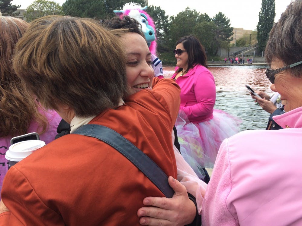 <p>Sarah Stockton spoke in front of a crowd of people at the Indianapolis Canal Walk. Crowd members listened to her testimony of how she underwent treatment for breast cancer and graduated college in less than a year. <em>DN PHOTO DANIELLE GRADY</em></p>
